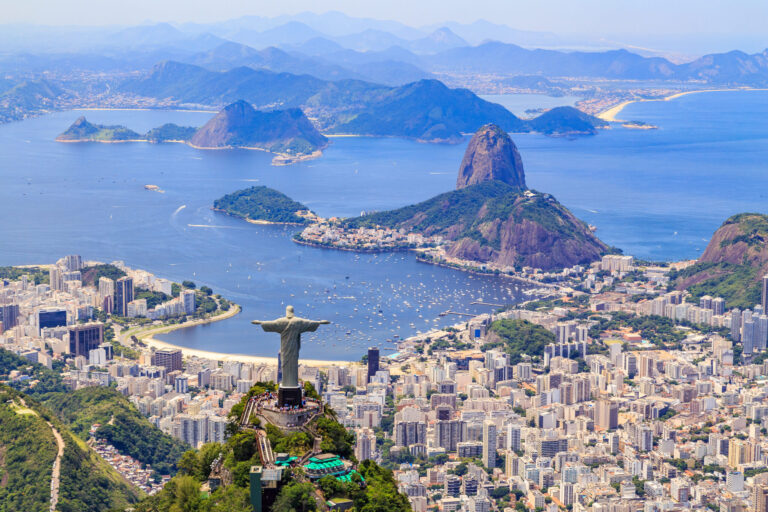 Aerial view of the Christ, The Redeemer Monument and the Corcovado Mountain in Rio de Janeiro, Brazil. One of the Seven Wonders of the World the monument is a must-go spot do travelers upon visiting Rio. Along with the beautiful statue the view of the Corcovado is breathtaking with the Sugarloaf Mountain and the Botafogo Bay among some of the places you can see from up there.